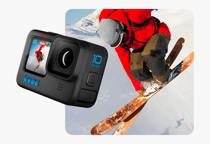 A gopro camera with someone skiing in the snow in the background